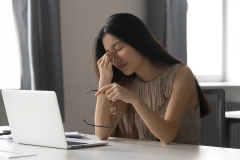 asian woman with eye strain