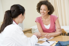 doctor speaks with women patient