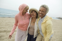 women walking on the beach together