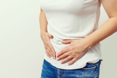 Young female suffering form stomach ache