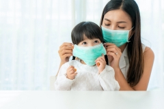 mom puts on mask her daughter