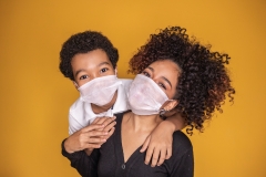 mom and son with mask on