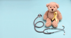 teddy bear with yellow ribbon