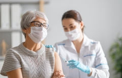 older patient receiving COVID-19 vaccine shot