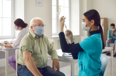 older patient preparing to be vaccinated