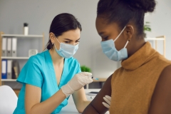 nurse administering vaccine