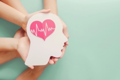  Adult and children hands holding paper brain and heart, brain stroke