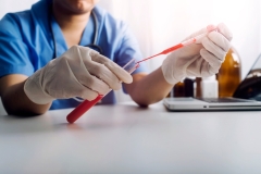 Concept fight against virus covid-19 corona virus, doctor or scientist in laboratory holding a syringe with liquid vaccines for children or older adults,Concept:diseases,medical care,science.