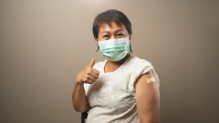 older woman after receiving her booster shot