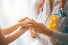 Girl patient listening to a doctor in medical office.