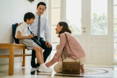 family with child getting ready for school