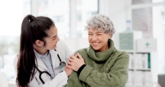 Happy, care and face of a doctor with a woman for medical trust, healthcare and help.