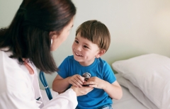 Doctor, stethoscope and child in hospital for healthcare, health and wellness with medical exam. 