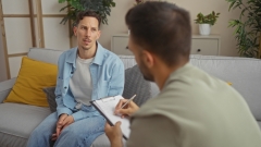 man speaking with doctor