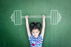 Strong kid weight lifting for empowering woman gender-children rights, equal opportunity awareness in education, international day of girl child, and sports for development and peace conceptual idea