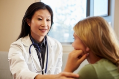 Doctor Treating Teenage Girl