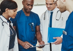 doctors gathering together to discuss care