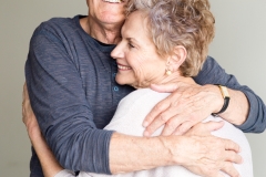 Older man and woman embracing