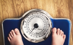 kids feet on weight scale