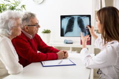 doctor discussing x-ray reports with patients