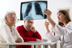 doctor and patients reviewing xrays