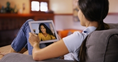 woman video chatting on her friend on an iPad