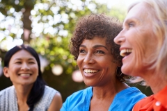 three women smiling together