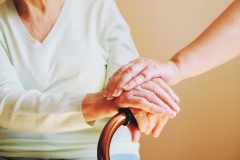 Senior woman with her caregiver at home.