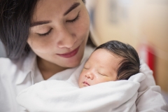 young asian mother with her newborn