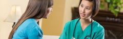 Doctor speaking to female patient