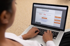 woman on computer reviewing Connect