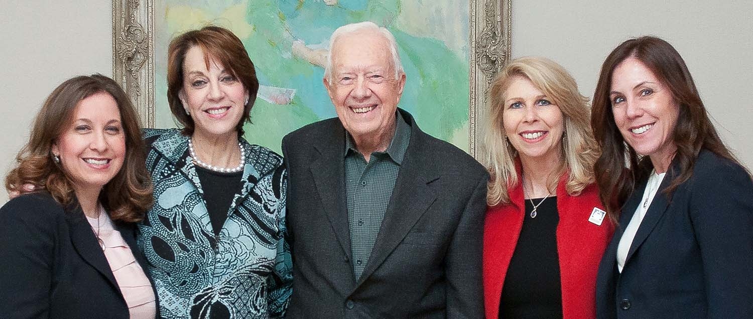 Dr. Allyson Ocean, Weill Cornell Medicine physician and co-founder of the pancreatic cancer advocacy group Let's Win, poses with the organization's co-founders and President Jimmy Carter, an honorary board member.