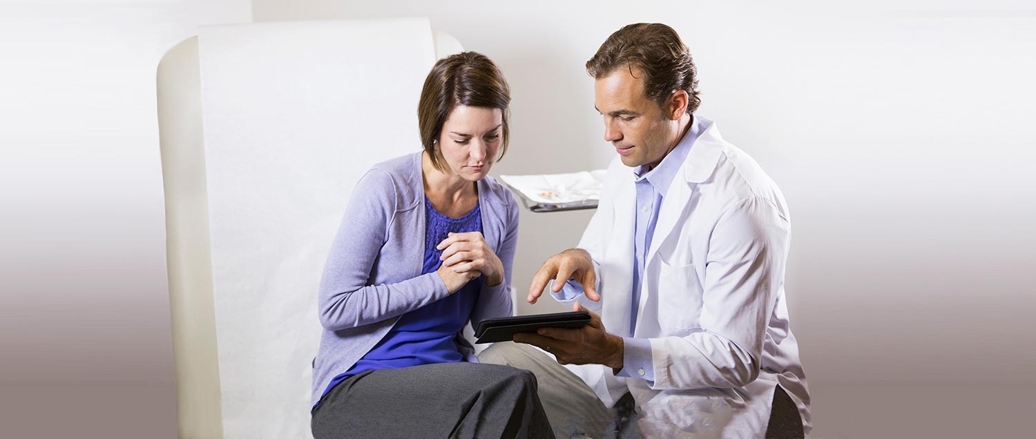 Photo of doctor speaking to a patient