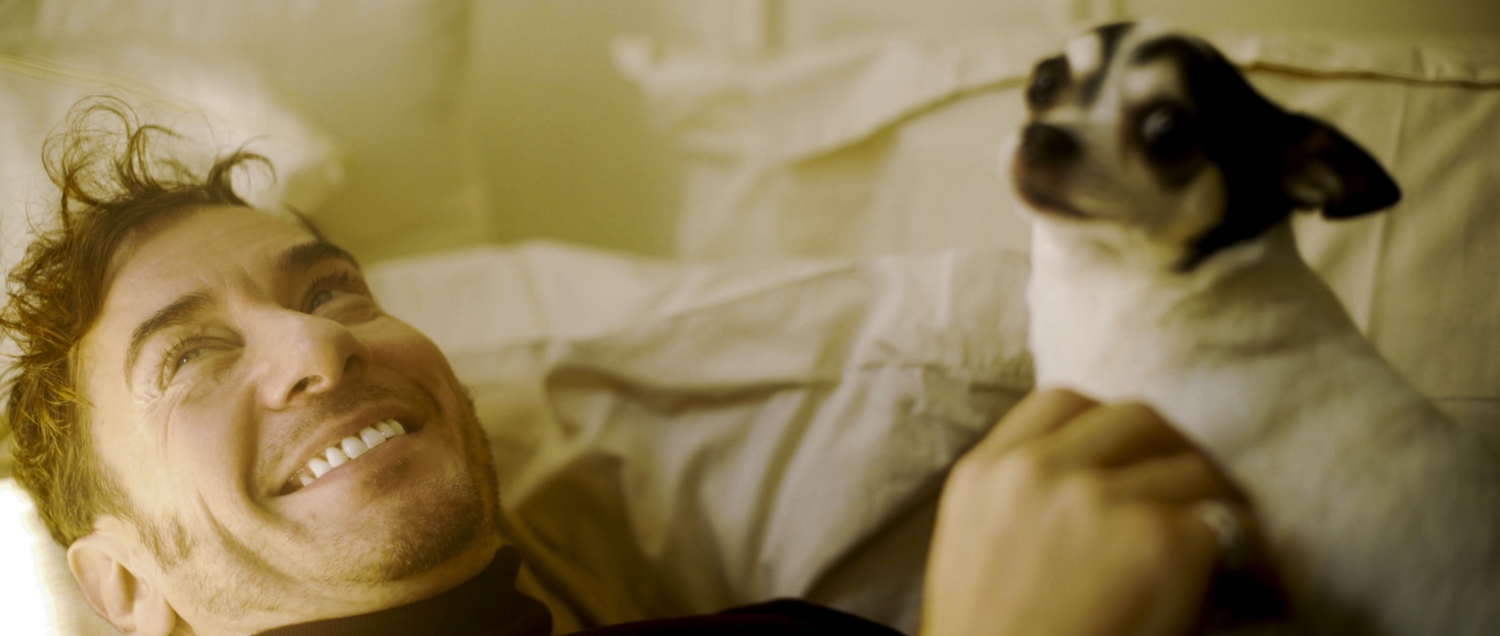 Timothy holding his dog