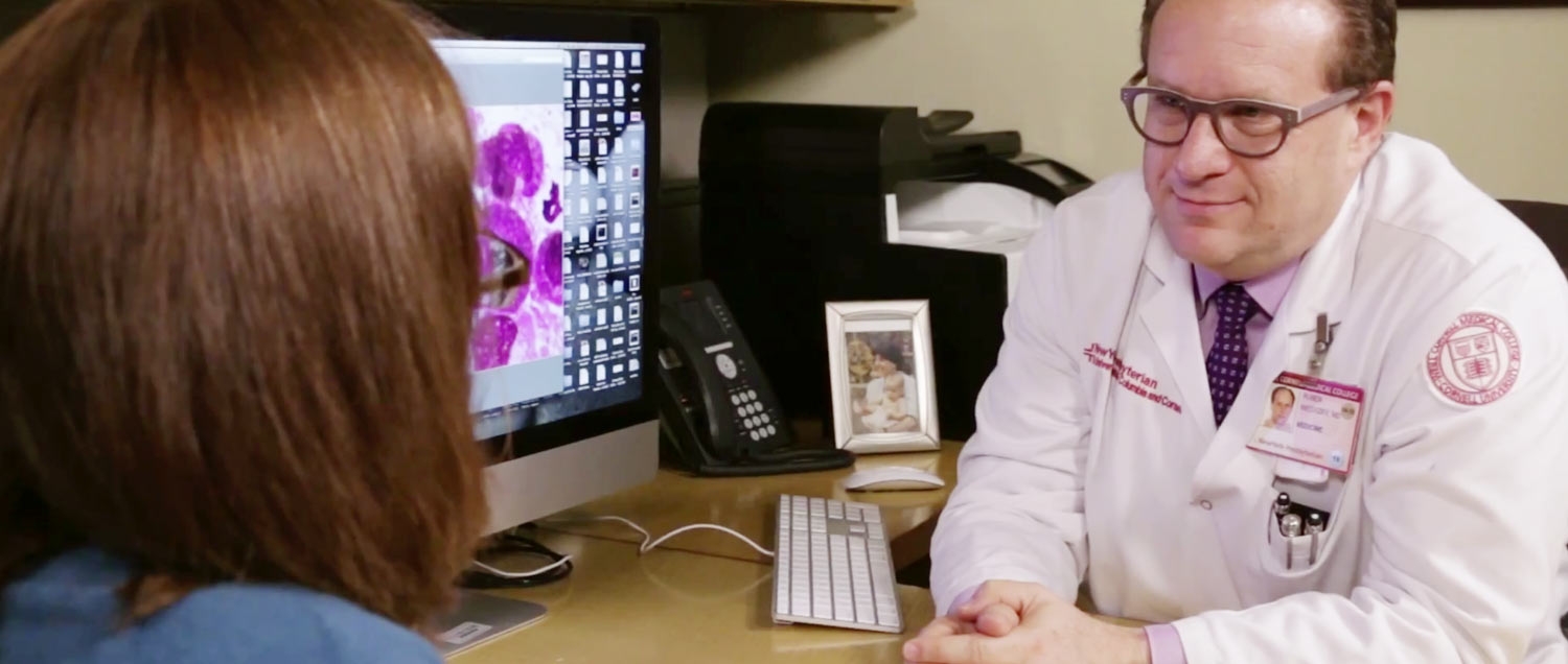 Photo of Myeloma doctor speaking to patient